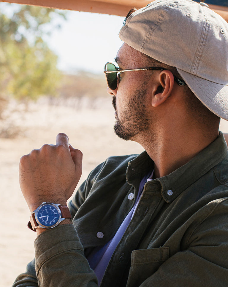 Man wearing a best-selling watch on wrist .  Browse our best-selling watches.