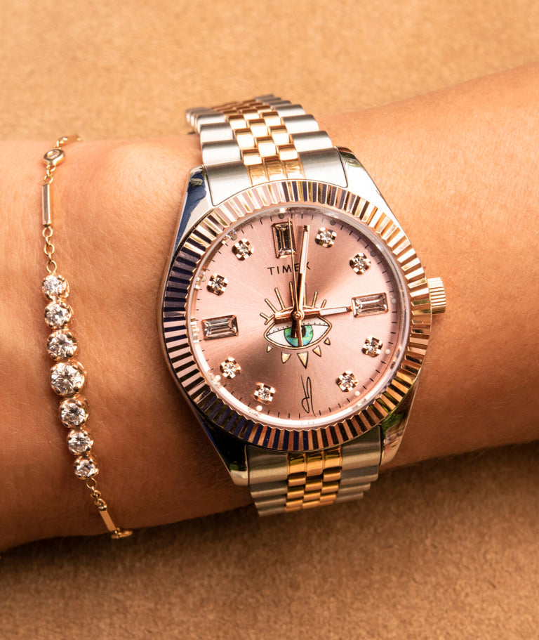Jacquie Aiche watch shown on womans wrist with a bracelet