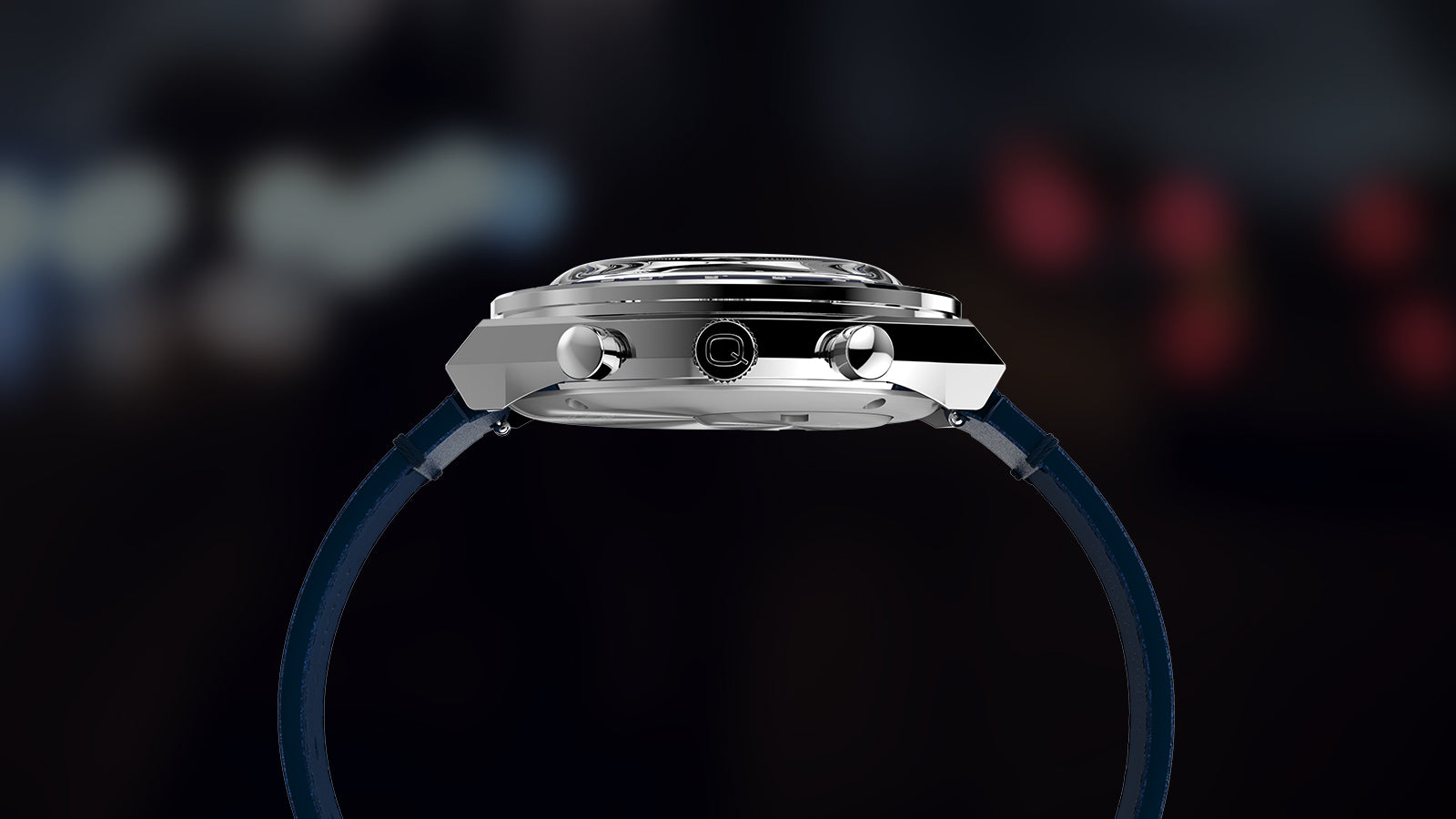 Side profile of the Q Timex® Chronograph with polished case, chronograph pushers, crown with Q logo, and blue strap.