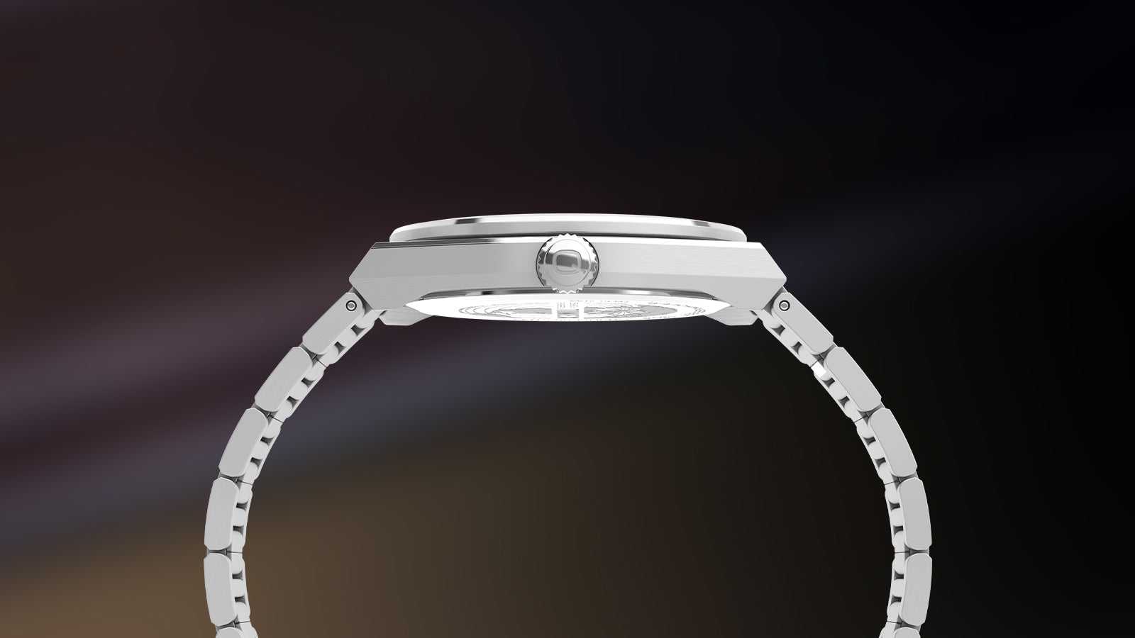 Side profile view of the Q Timex® Continental Day and Date watch showcasing its slim stainless-steel case, domed crystal, and crown detailing. The metal bracelet curves gracefully, reflecting minimalist vintage precision.