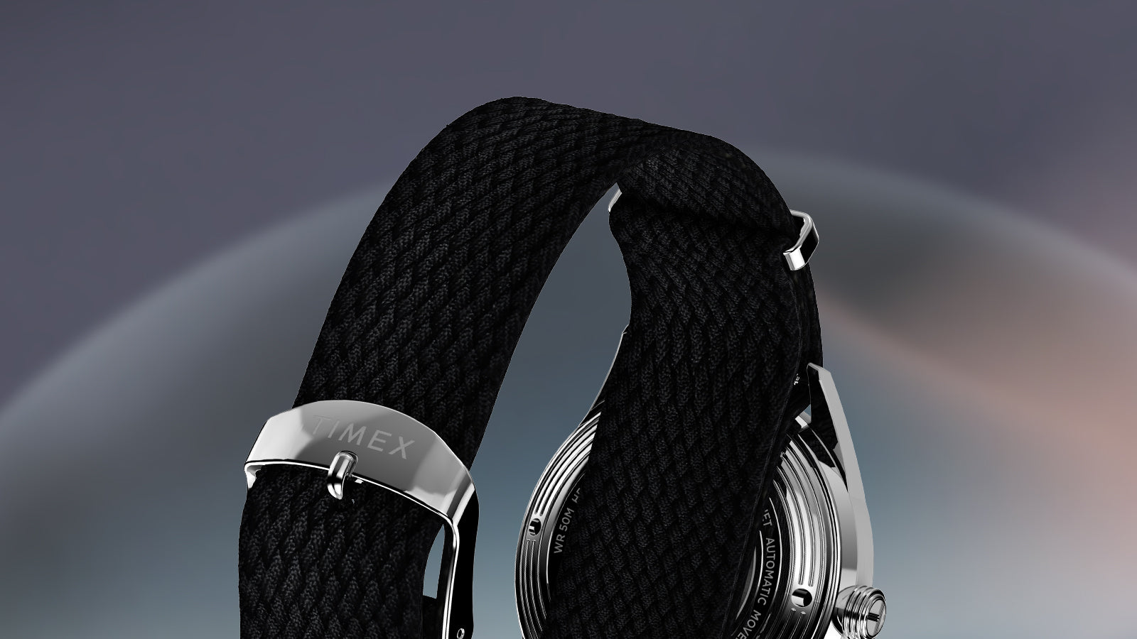 Rear view of Timex Marlin Jet Automatic featuring stainless steel buckle engraved with ‘Timex’ and woven black strap.