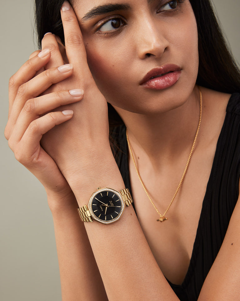 A Women Wearing Timex UFC Jewel Gold Stainless Steel Bracelet Watch