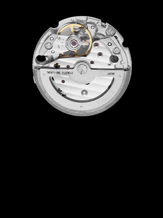 Close-up of a mechanical watch movement on a black background