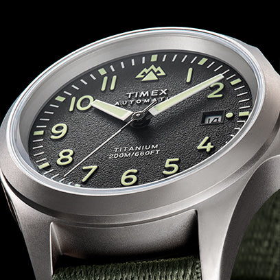 The Timex Expedition® watch in close-up, showing luminescent numerals and hands designed for readability in low light.