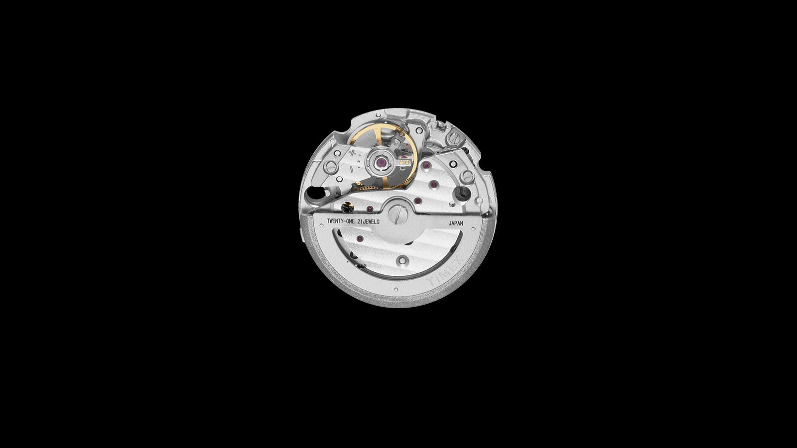 Close-up of the automatic mechanical movement inside the Timex Marlin® Jet, featuring 21 jewels and visible rotor engraving, against a black background.