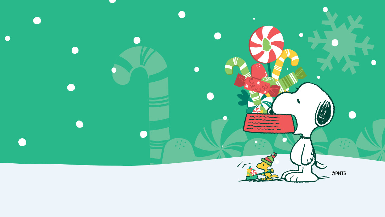 Illustration of Snoopy carrying a large red gift box filled with candy canes and presents, while Woodstock walks beside him in a festive hat. Background features green snowflakes and candy patterns.