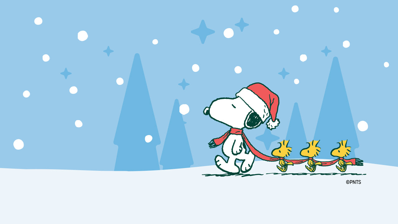 Illustration of Snoopy wearing a Santa hat and red scarf, walking through the snow while pulling three Woodstocks behind him with a red leash, set against a blue winter background with falling snow and pine trees.