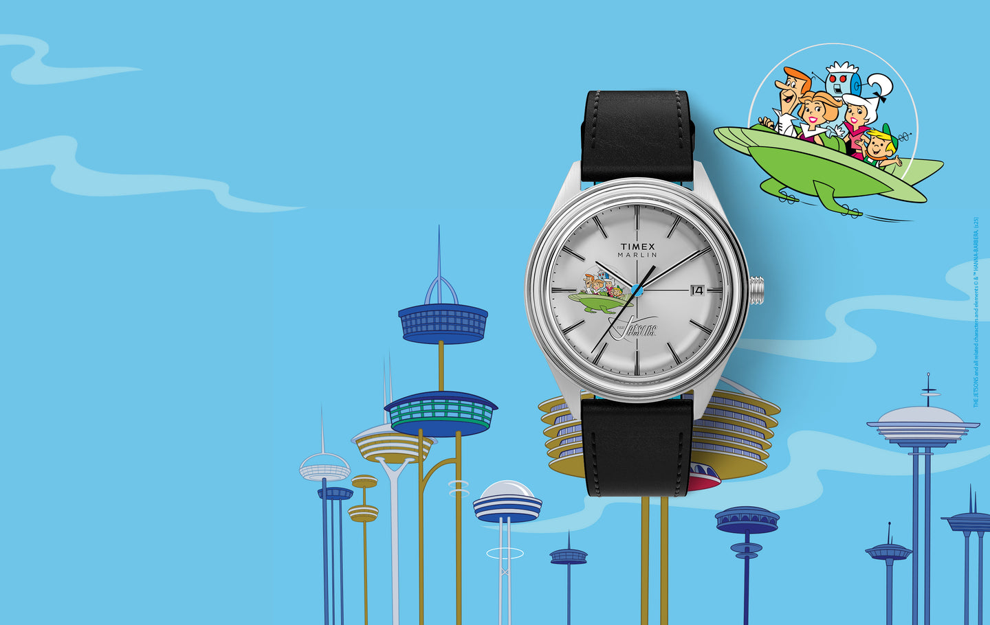 A Timex Marlin wristwatch featuring The Jetsons on the dial. The silver watch with a black leather strap shows George, Jane, Judy, Elroy, and Astro in their green flying car. The background includes a futuristic Jetsons-style cityscape with tall buildings and the family flying in their spacecraft.