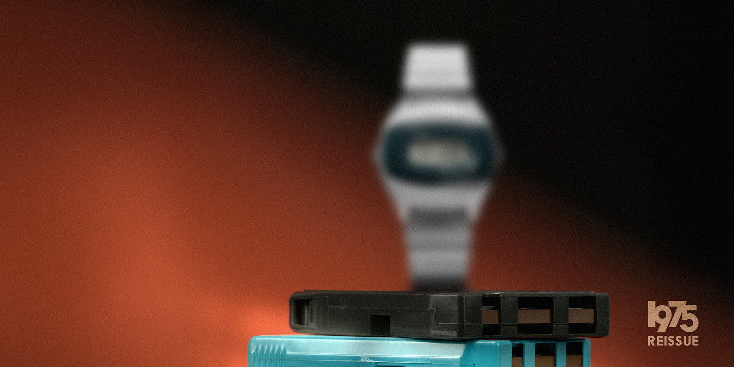 Promotional image for the Q Timex SSQ 1975 Reissue watch, featuring a blurred digital watch in the background with vintage cassette tapes in focus, and '1975 Reissue' text in the corner.