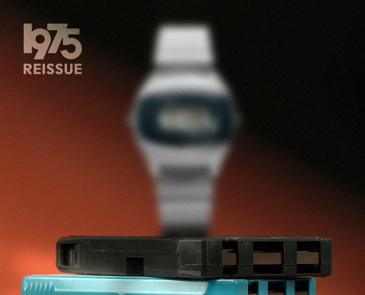 Promotional image for the Q Timex SSQ 1975 Reissue watch, featuring a blurred digital watch in the background with vintage cassette tapes in focus, and '1975 Reissue' text in the corner.