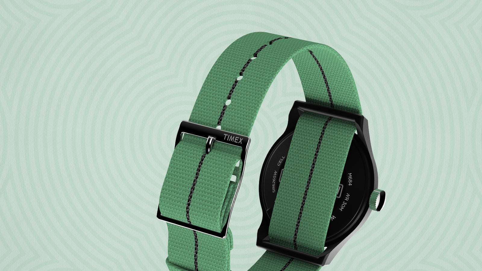 Rear view of the Timex x Monopoly MK1 wristwatch highlighting its mint-green nylon strap with black stitching and matte black buckle engraved with the Timex logo. The case back is black stainless steel and water-resistant to 30 meters.