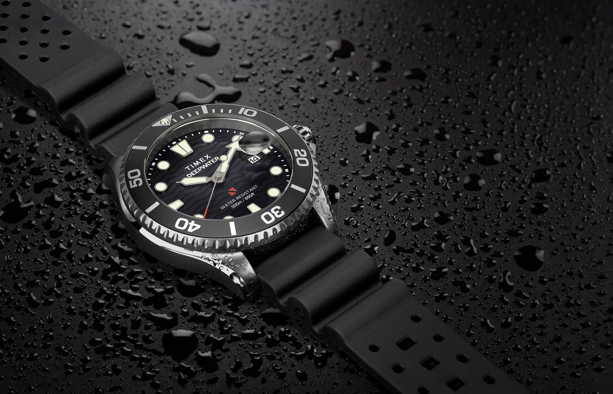 Timex Deepwater Meridian 200 dive watch with black strap and wave-textured black dial resting on a surface covered in water droplets, emphasizing its 200-meter water resistance and rugged construction.