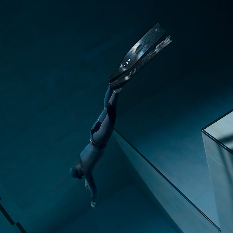 Freediver captured underwater wearing the Timex Deepwater Reef 200, demonstrating its 200-meter water resistance and functionality in deep diving conditions.