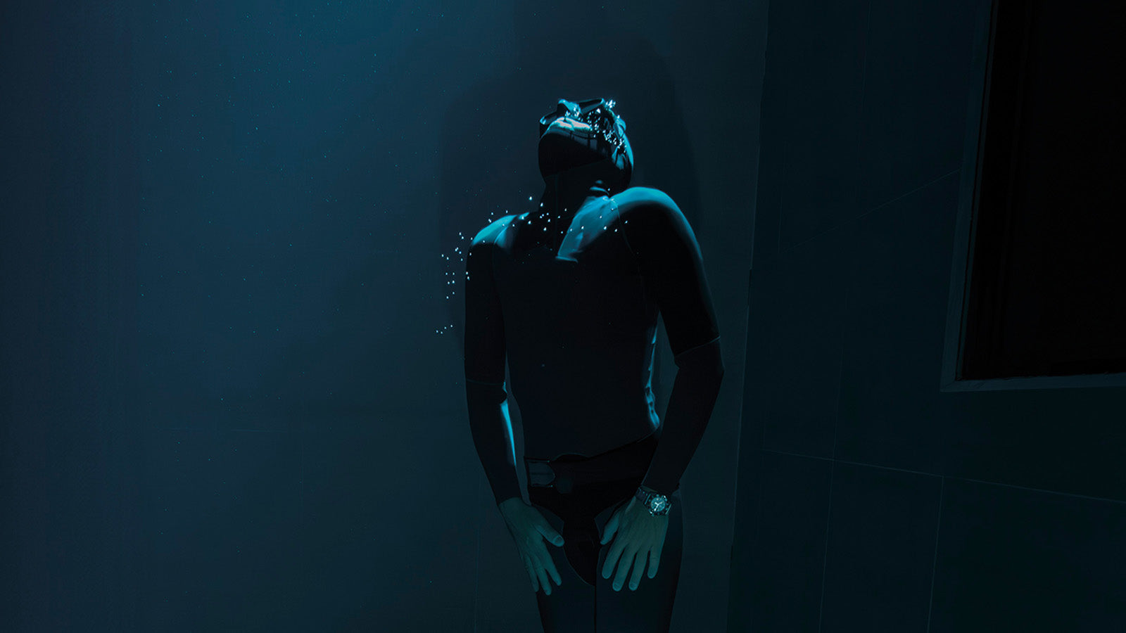 Diver underwater wearing the Timex Deepwater Reef 200, the watch glowing softly in the deep blue environment, representing endurance and precision.