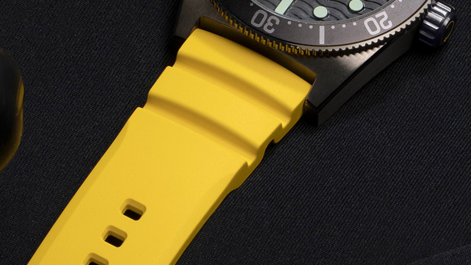 Macro shot of Timex Deepwater Reef 200’s yellow silicone strap and matte-finish lugs, showcasing durable dive-ready construction and bold color detailing.