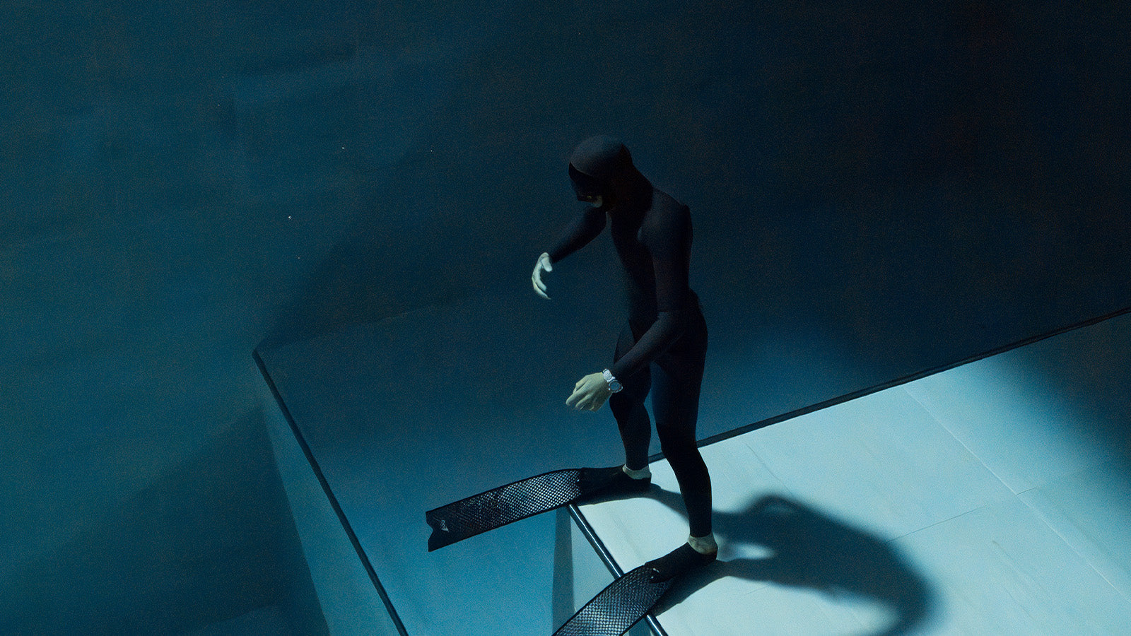 Diver underwater wearing the Timex Deepwater Reef 200 GMT, illustrating its robust construction and 200-meter water resistance.