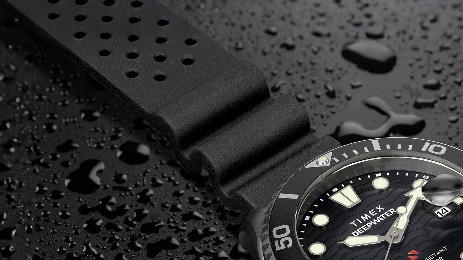 Close-up of the Timex Deepwater Meridian 200’s textured black silicone strap with water droplets, highlighting its durable and comfortable dive-ready design.