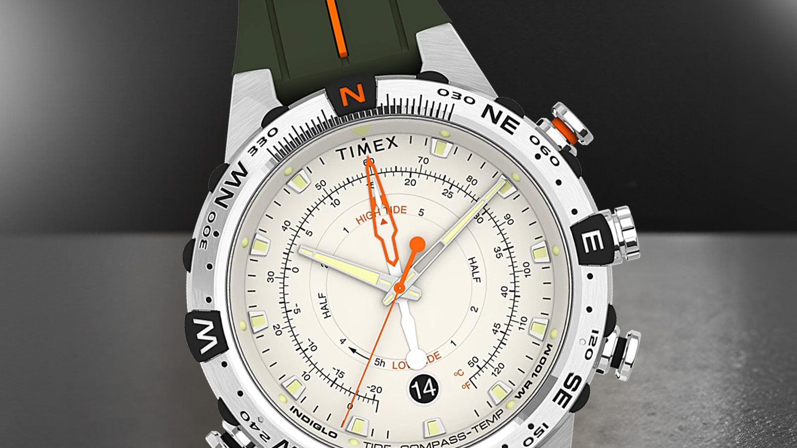 Front view of the Timex Expedition Tide-Temp-Compass watch showcasing its cream dial with orange tide hand, luminous markers, compass bezel, and a black date window at 6 o’clock.