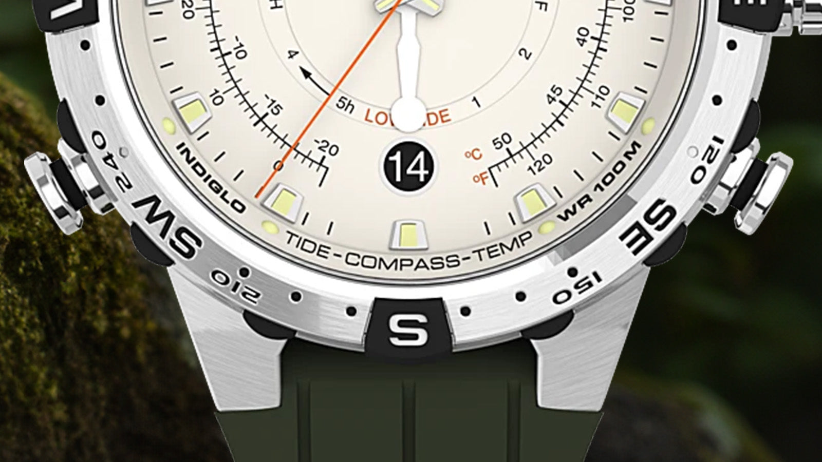 Close-up of the lower dial of the Timex Expedition Tide-Temp-Compass watch with cream background, orange tide hand, black date display at 6 o’clock, and indicators for compass and temperature.