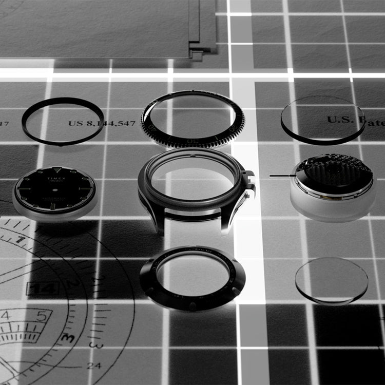 Flat lay of Timex Atelier components in an exploded view — including bezel, case, crystal, and dial — arranged over a technical grid blueprint.