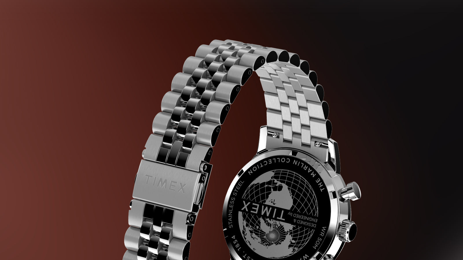 Rear view of Timex Marlin Chronograph Tachymeter showing stainless-steel bracelet clasp engraved with Timex logo and caseback with globe etching.