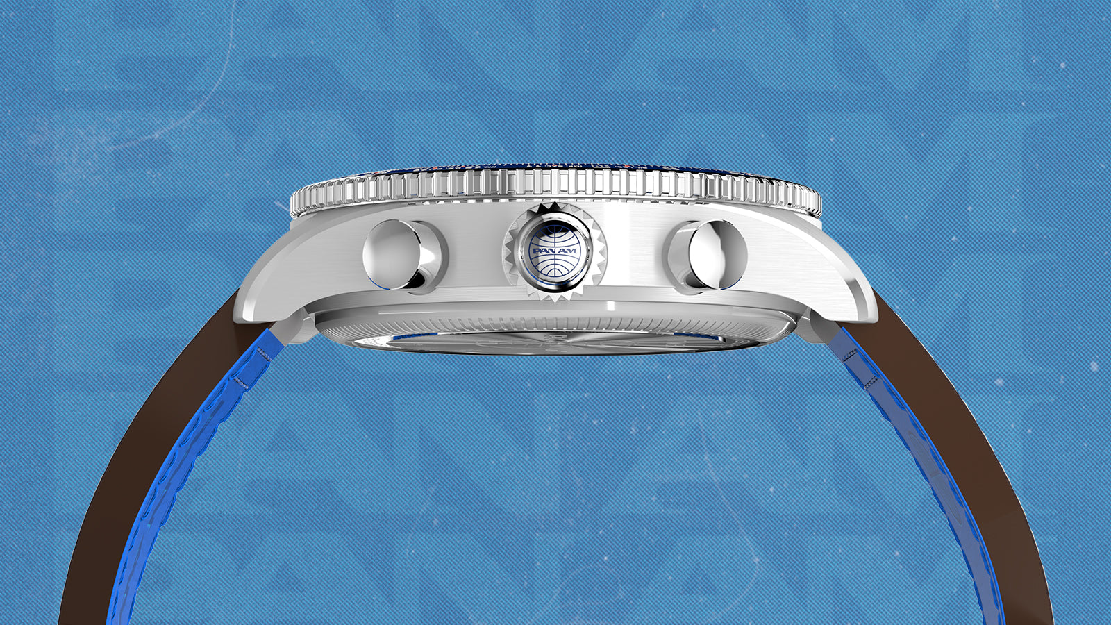 Side profile of the Timex x Pan Am® Fly-Back Chronograph highlighting the brushed stainless-steel case, crown with Pan Am logo, and chronograph pushers. The image shows the curved crystal and overall sleek build of the watch against a blue textured background.
