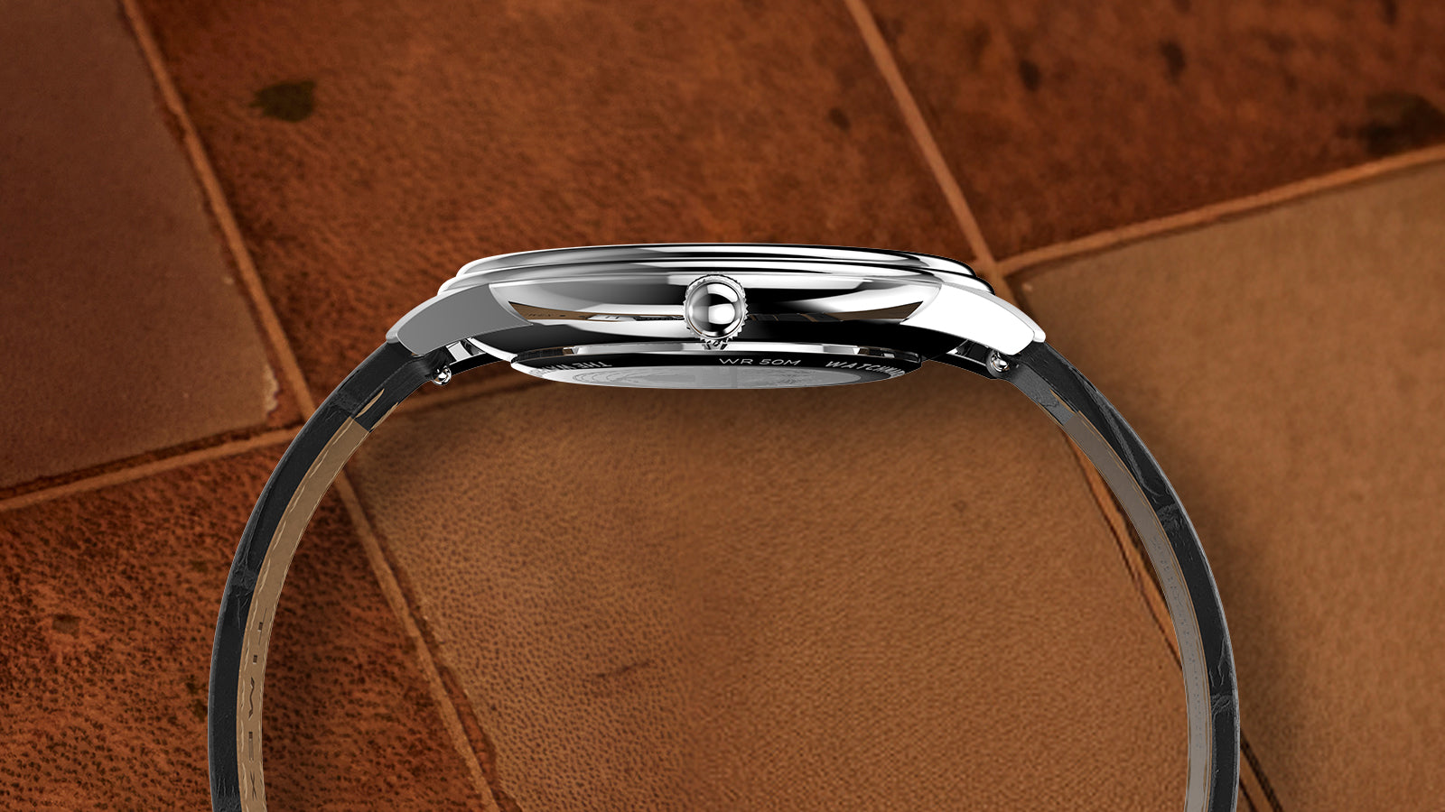 Side view of the Timex Waterbury Metropolitan Sub-Second watch showing slim stainless steel case, polished crown, and black leather strap.