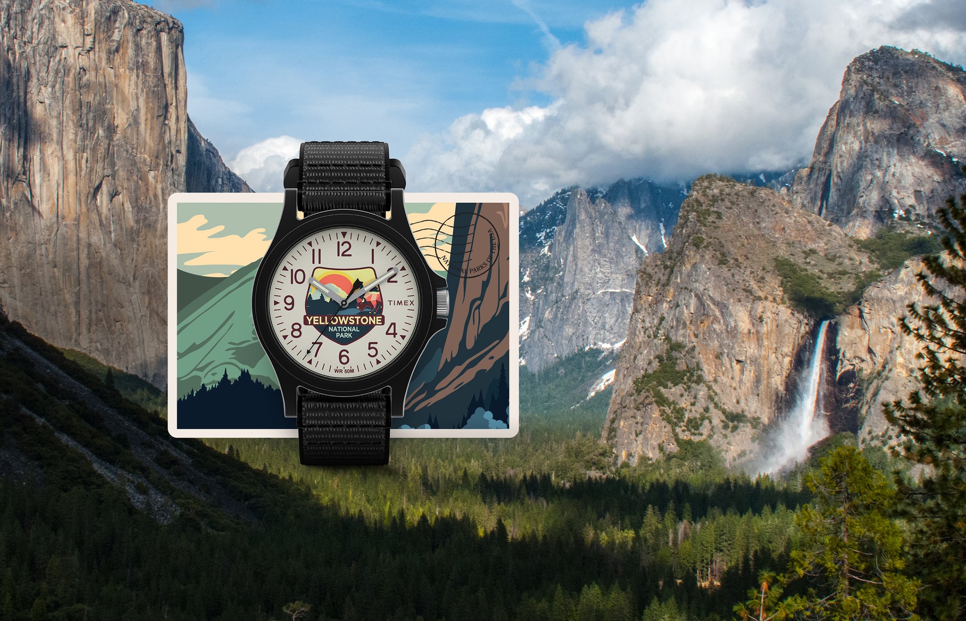 Timex Yellowstone National Park watch with black case and strap, featuring a colorful mountain and bison dial design, displayed over a postcard-style background with cliffs and waterfalls.
