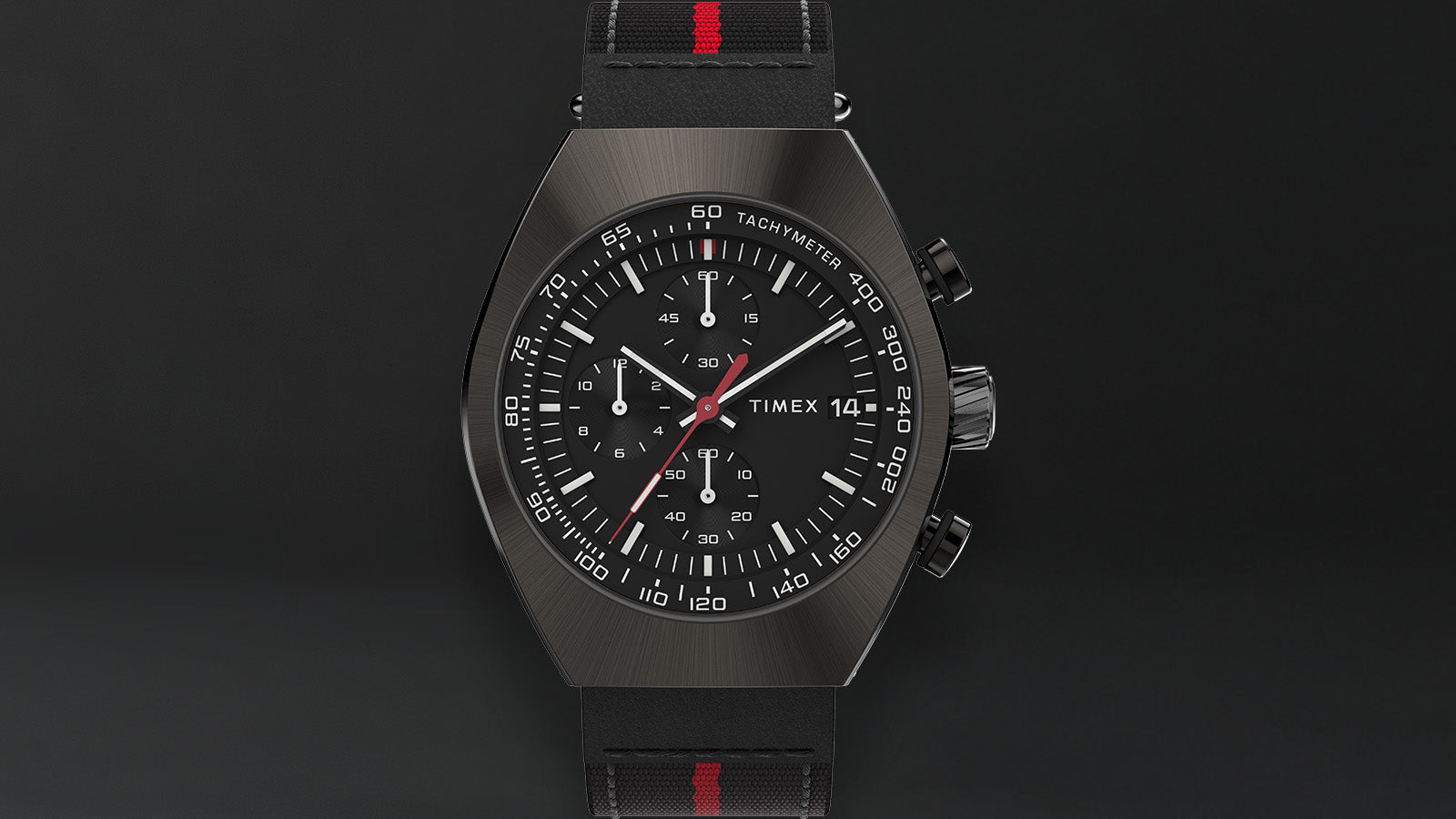 Close-up of the Timex Legacy Tonneau Chronograph dial showcasing its three sub-dials, red chronograph hand, and detailed tachymeter markings.