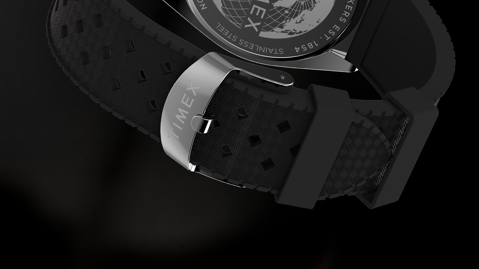 Close-up of the black textured rubber strap and polished stainless-steel buckle engraved with “Timex” on the Legacy Tonneau Chronograph watch.