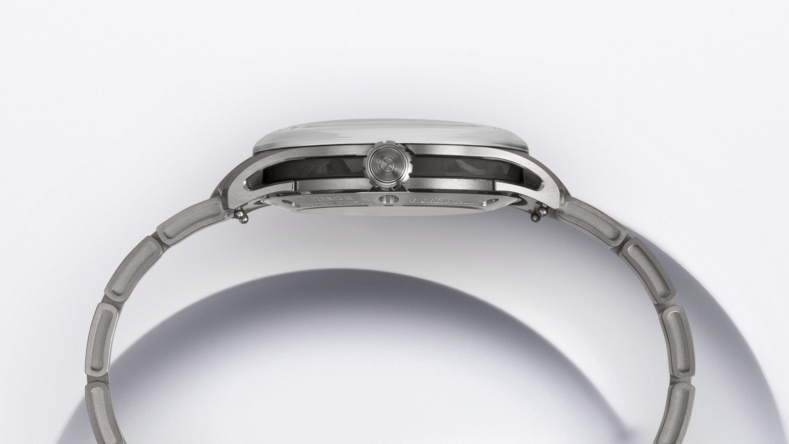 Macro shot of the automatic movement visible through the exhibition back of the Timex Giorgio Galli S2Ti watch, held gently in hand.