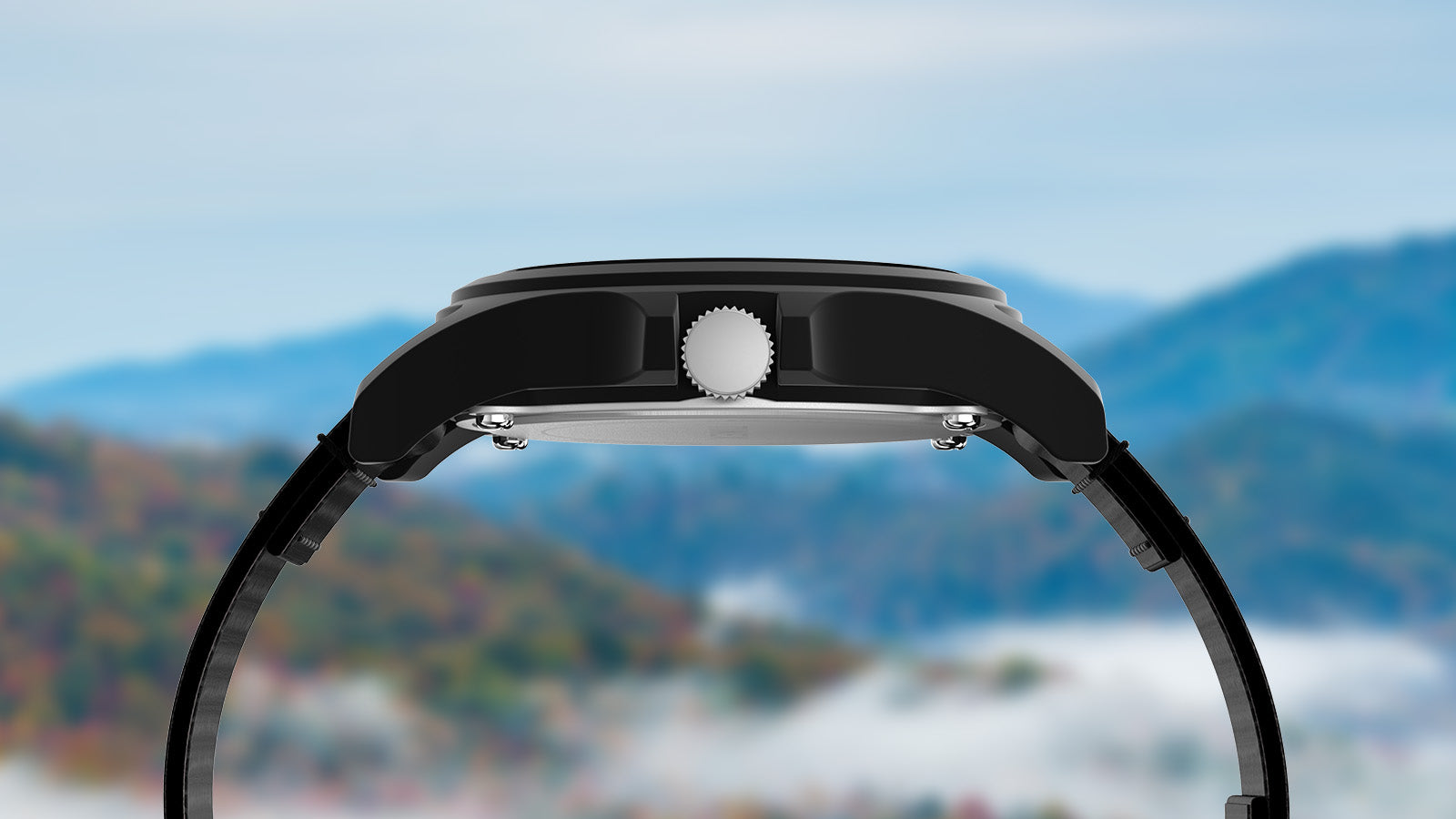 Side profile of the Timex Great Smoky Mountains National Park watch highlighting the matte black case and crown, set against a misty mountain background.