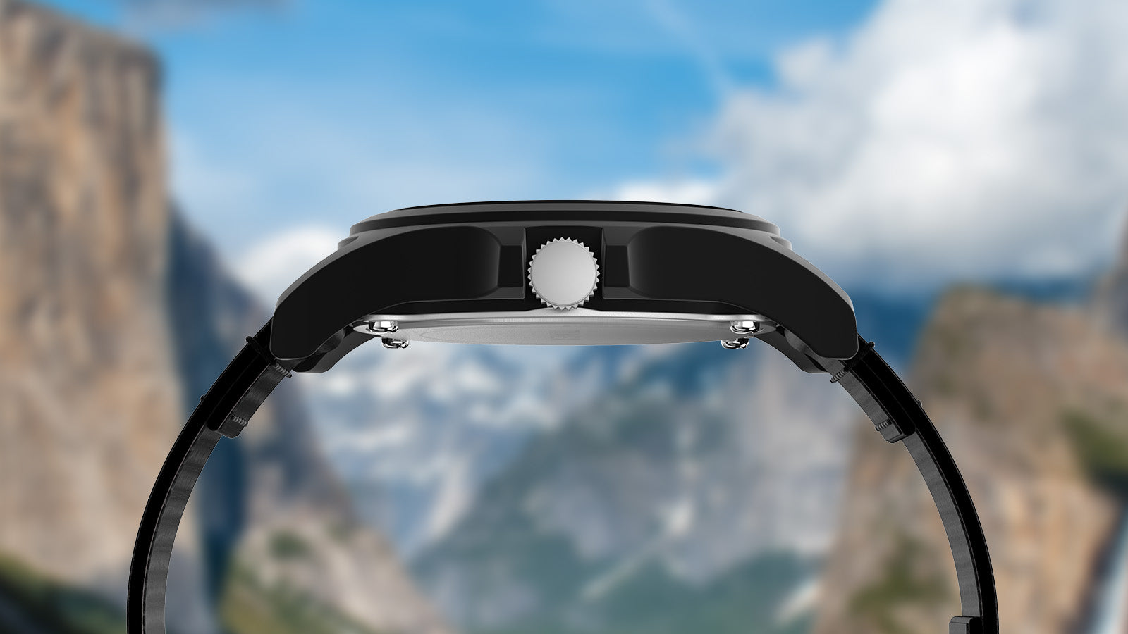 Side profile of the Timex Yellowstone National Park watch, highlighting its matte black case and crown with scenic mountain peaks in the background.