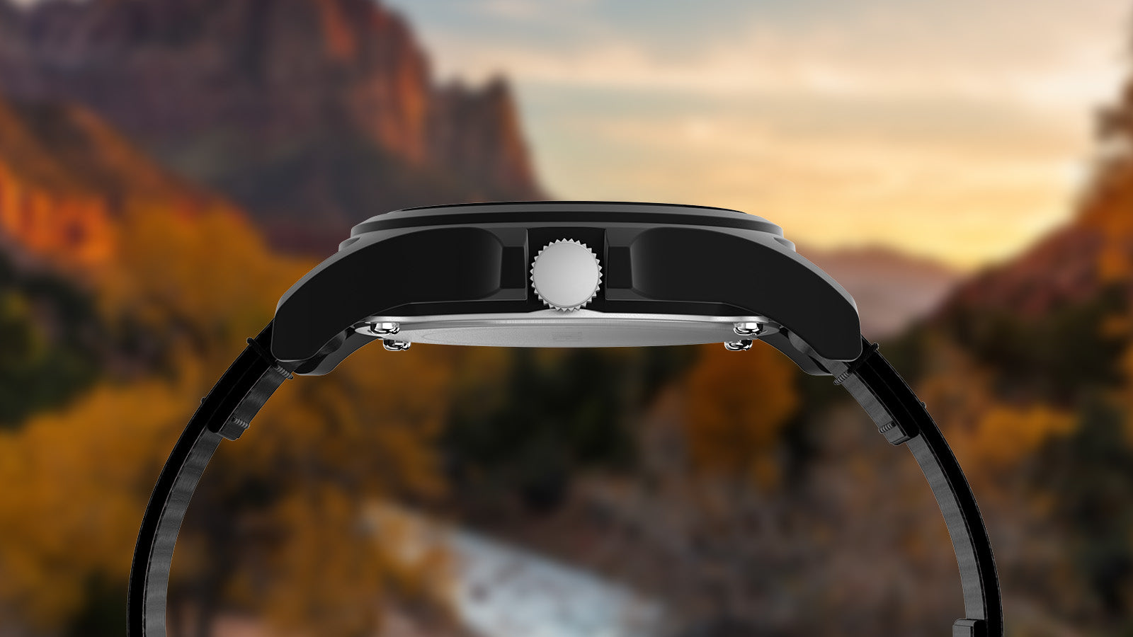 Side profile of the Timex Zion National Park watch highlighting its matte black case and crown, with a scenic desert canyon backdrop.