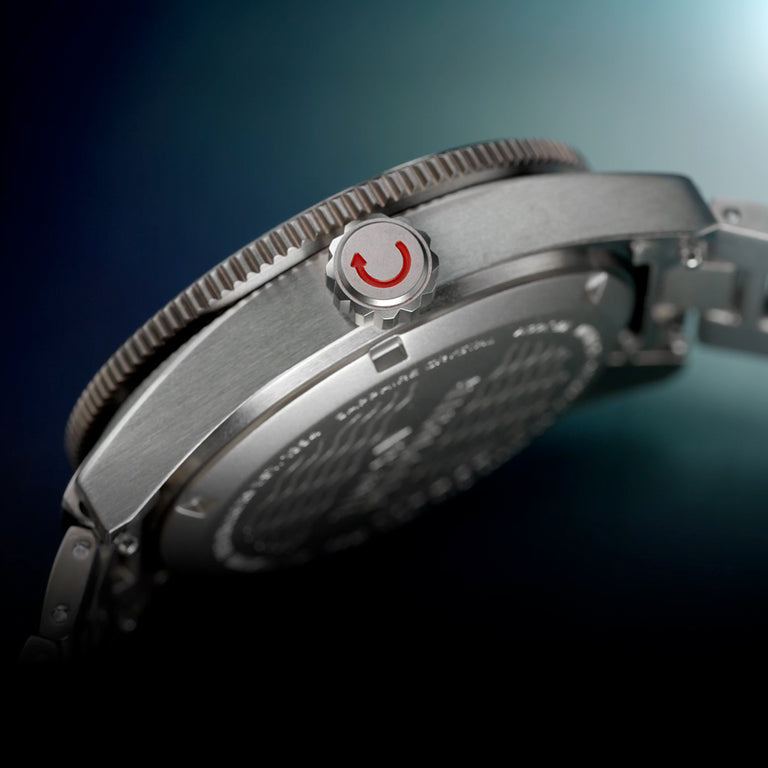 Side profile of the Timex Deepwater Reef 200 Titanium showing the brushed case, screw-down crown with red accent, and sapphire caseback.