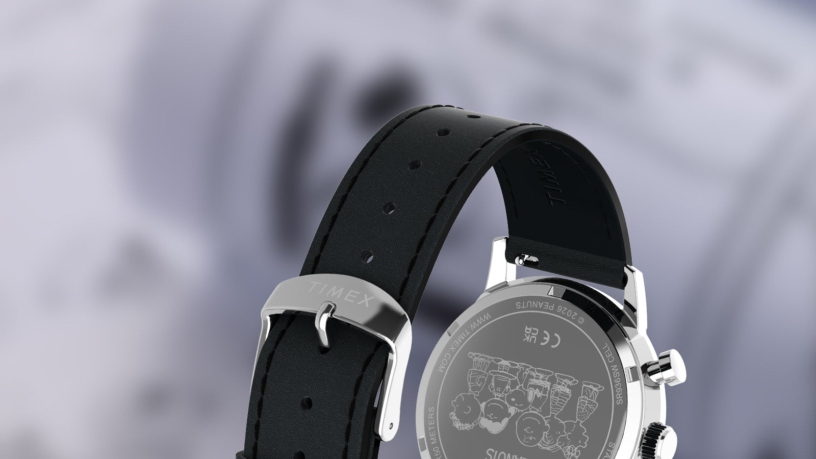 Rear view of the Peanuts® x Timex Marlin® Chronograph Joe Cool watch showing the stainless steel caseback engraved with Peanuts characters and a black leather strap with Timex buckle.