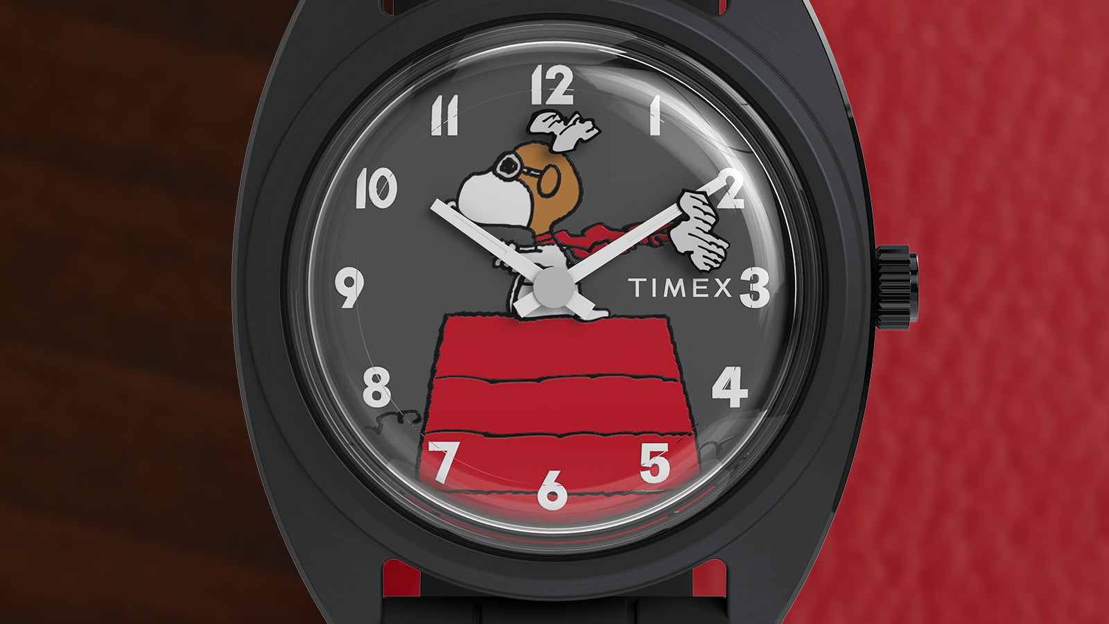 Macro detail of Peanuts® x Timex 1979 Reissue Inspired gray dial featuring Snoopy as the Flying Ace standing on his red doghouse with white Arabic numerals.
