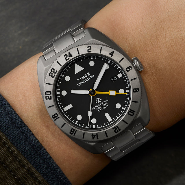 Detailed wrist shot of the Expedition® Pioneer Titanium Automatic GMT with titanium case, 24-hour bezel, and bracelet.
