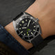 Timex Expedition Pioneer Titanium Automatic watch worn on wrist with black rubber strap