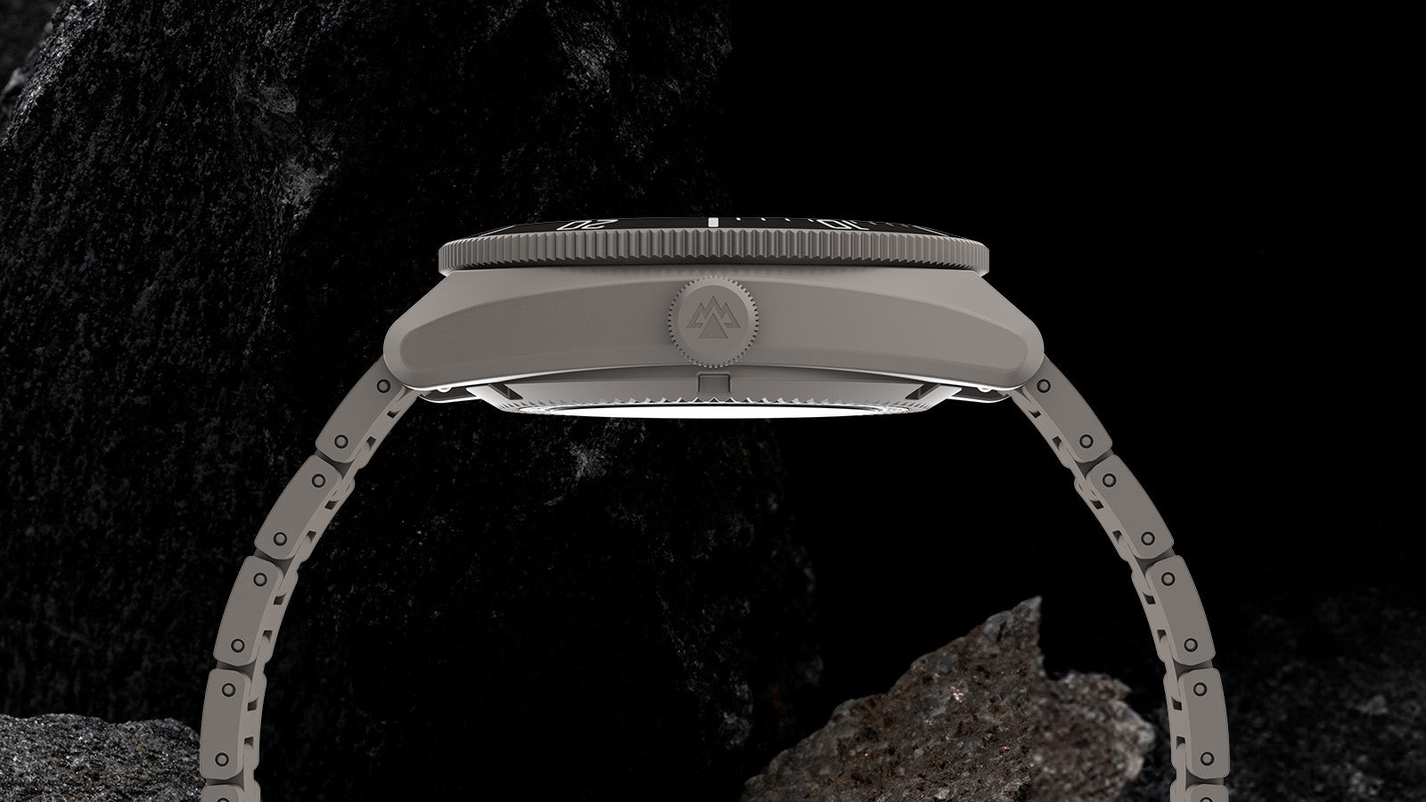 Side profile of the Expedition® Pioneer Titanium Automatic showing the lightweight titanium case, signed crown, and bracelet links.