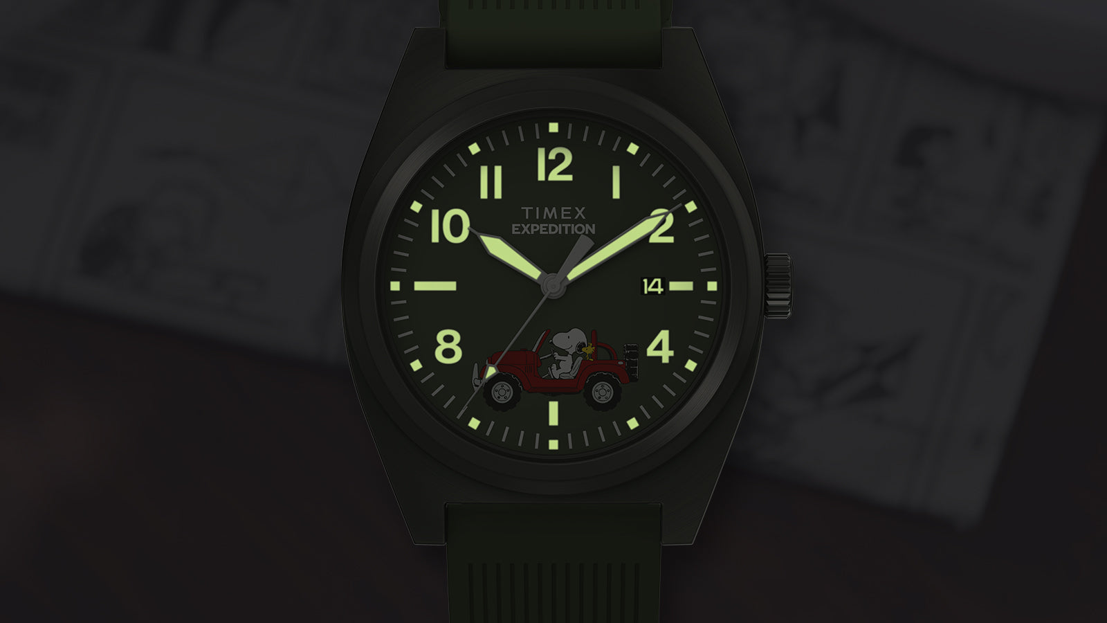 Peanuts® x Timex Expedition Snoopy Road Trip watch illuminated with INDIGLO® backlight, highlighting luminous numerals and Snoopy red Jeep artwork on green dial.