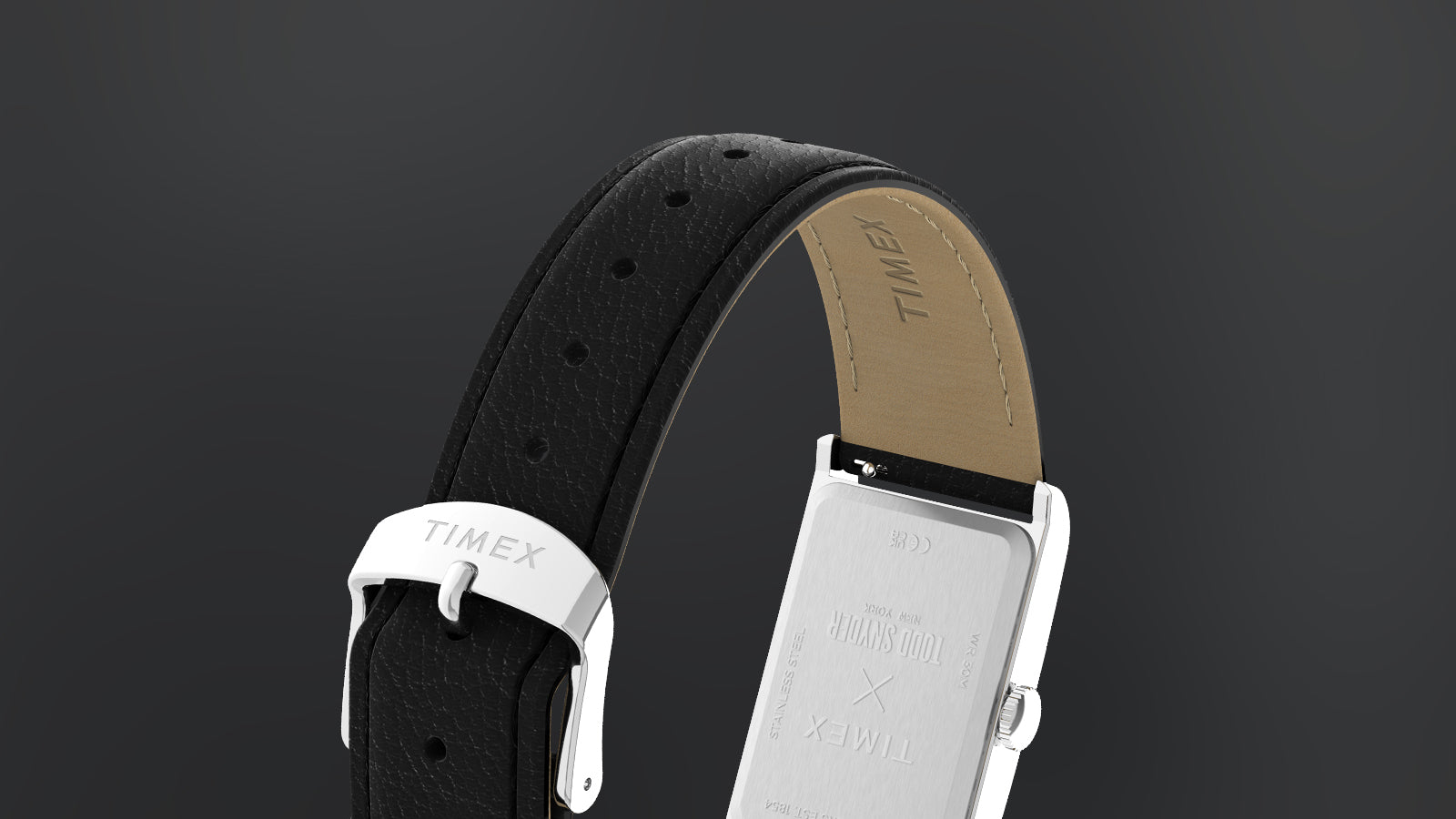 Rear view of the Timex x Todd Snyder 1976 Lexington watch showing the stainless steel case back and black leather strap with buckle.