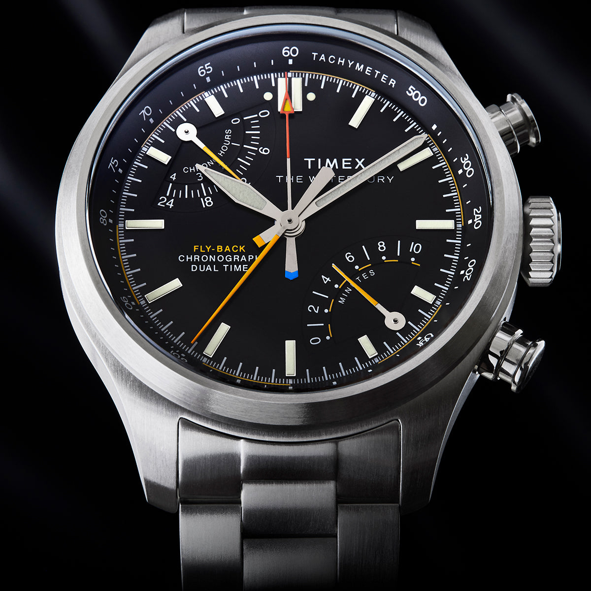 Close-up of Timex Waterbury Ace Fly-Back Chronograph dial showing subdials, tachymeter scale, and luminous hands