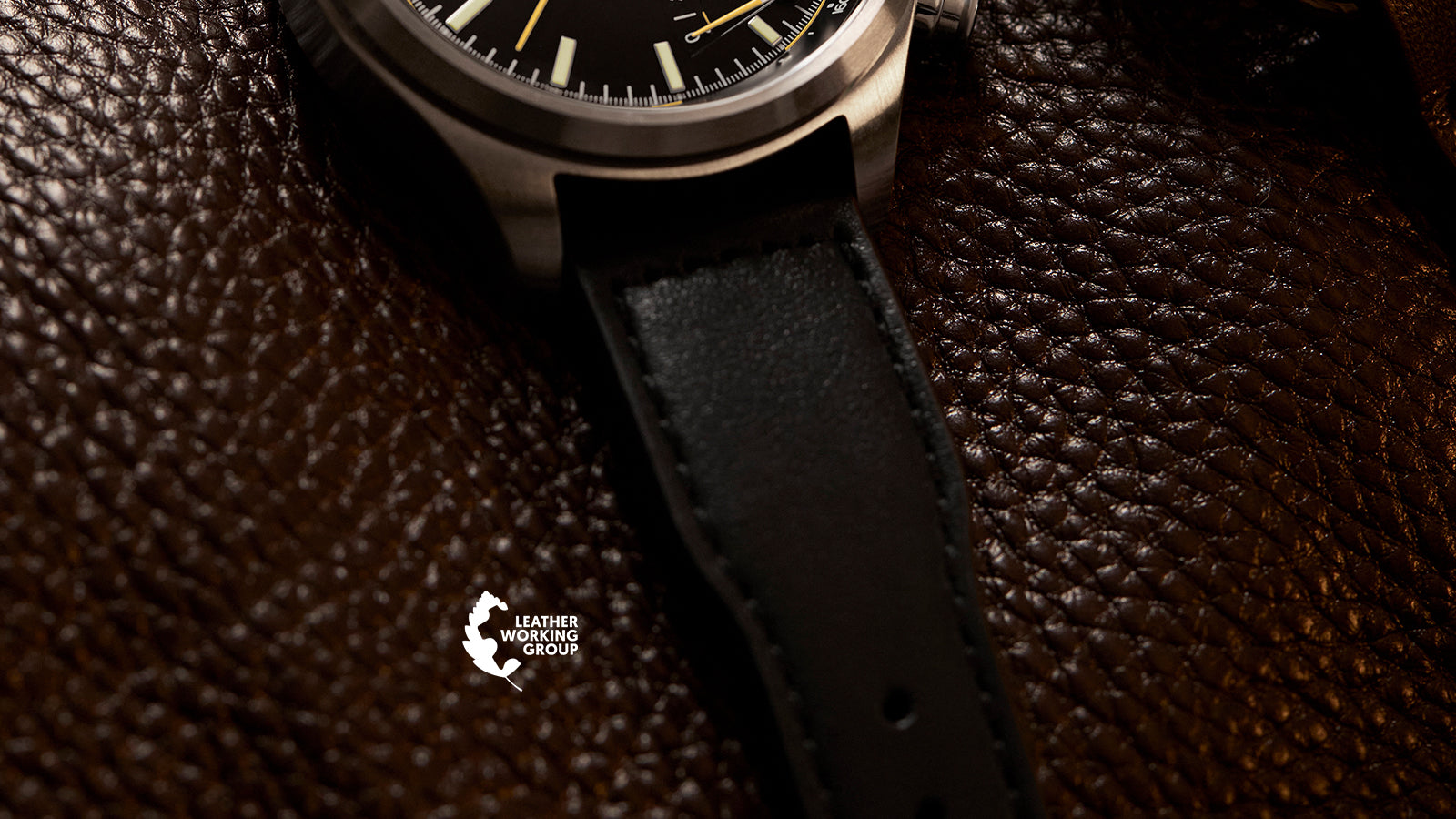 Timex Waterbury Ace Fly-Back Chronograph leather strap detail on textured brown leather surface with Leather Working Group logo