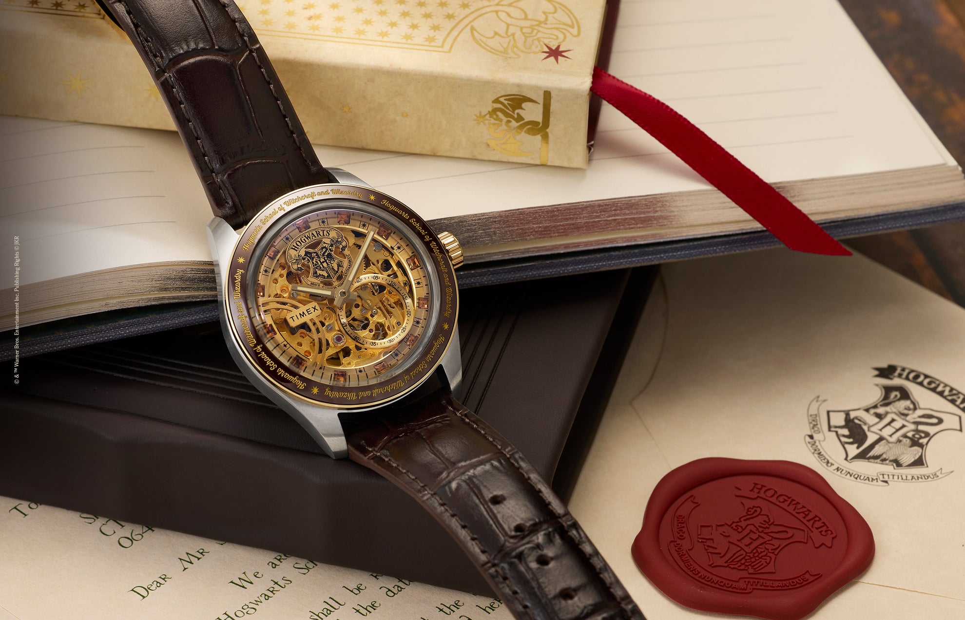 Harry Potter x Timex Waterbury Skeleton Automatic watch with brown leather strap displayed on an open Hogwarts letter with red wax seal.