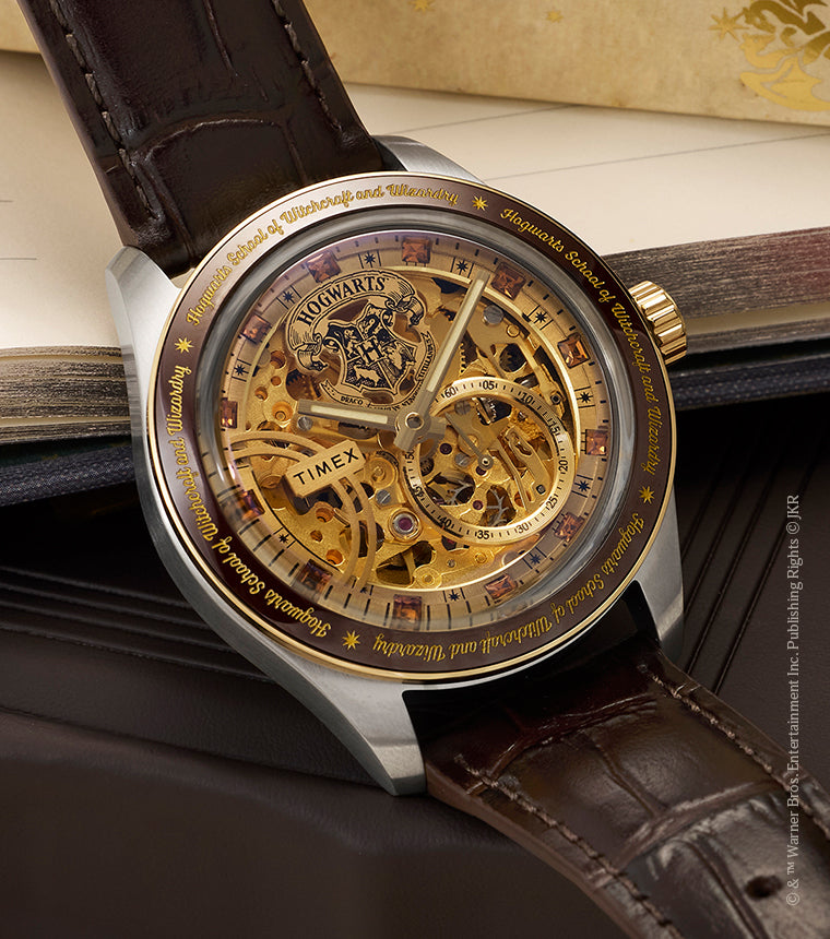 Harry Potter x Timex Waterbury Skeleton Automatic watch with brown leather strap displayed on an open Hogwarts letter with red wax seal.
