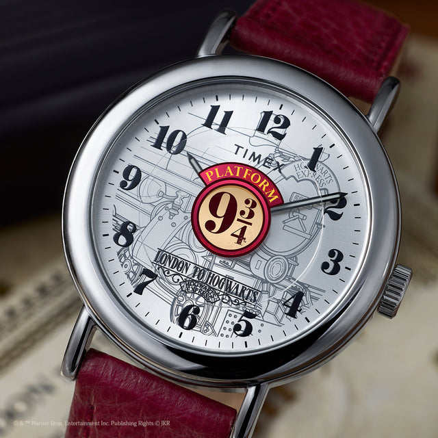 Harry Potter x Timex Weekender Platform 9¾ watch showing detailed train illustration and bold black numerals on white dial.