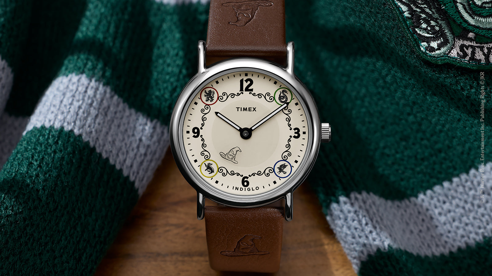 Front view of Harry Potter x Timex Weekender Slytherin House watch with silver-tone case and house-themed dial.