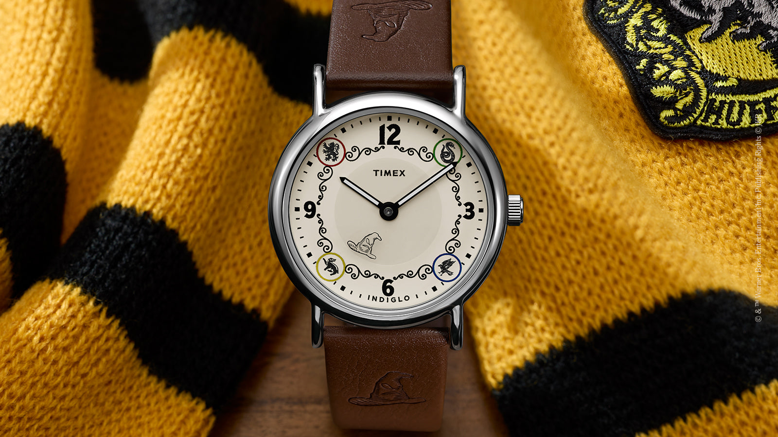 Front view of Harry Potter x Timex Weekender Hufflepuff House watch with silver-tone case and house-themed dial.