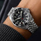 Timex Deepwater Arctic stainless steel watch worn on wrist with black dial and dive bezel